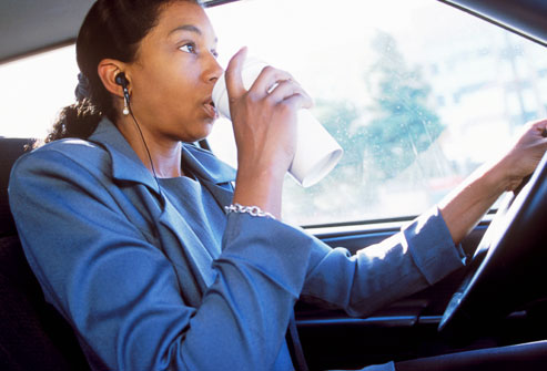 getty_rm_photo_of_woman_drinking_coffee_while_driving