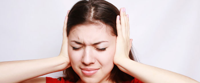 woman-covering-her-ears